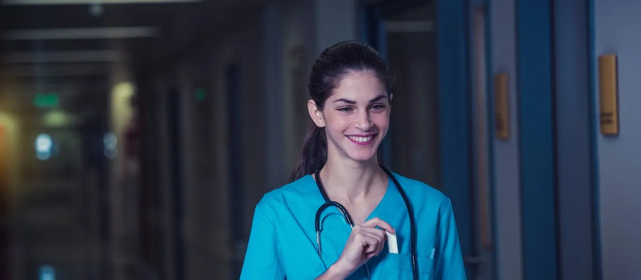 nurse who is working the night shift walking in hospital